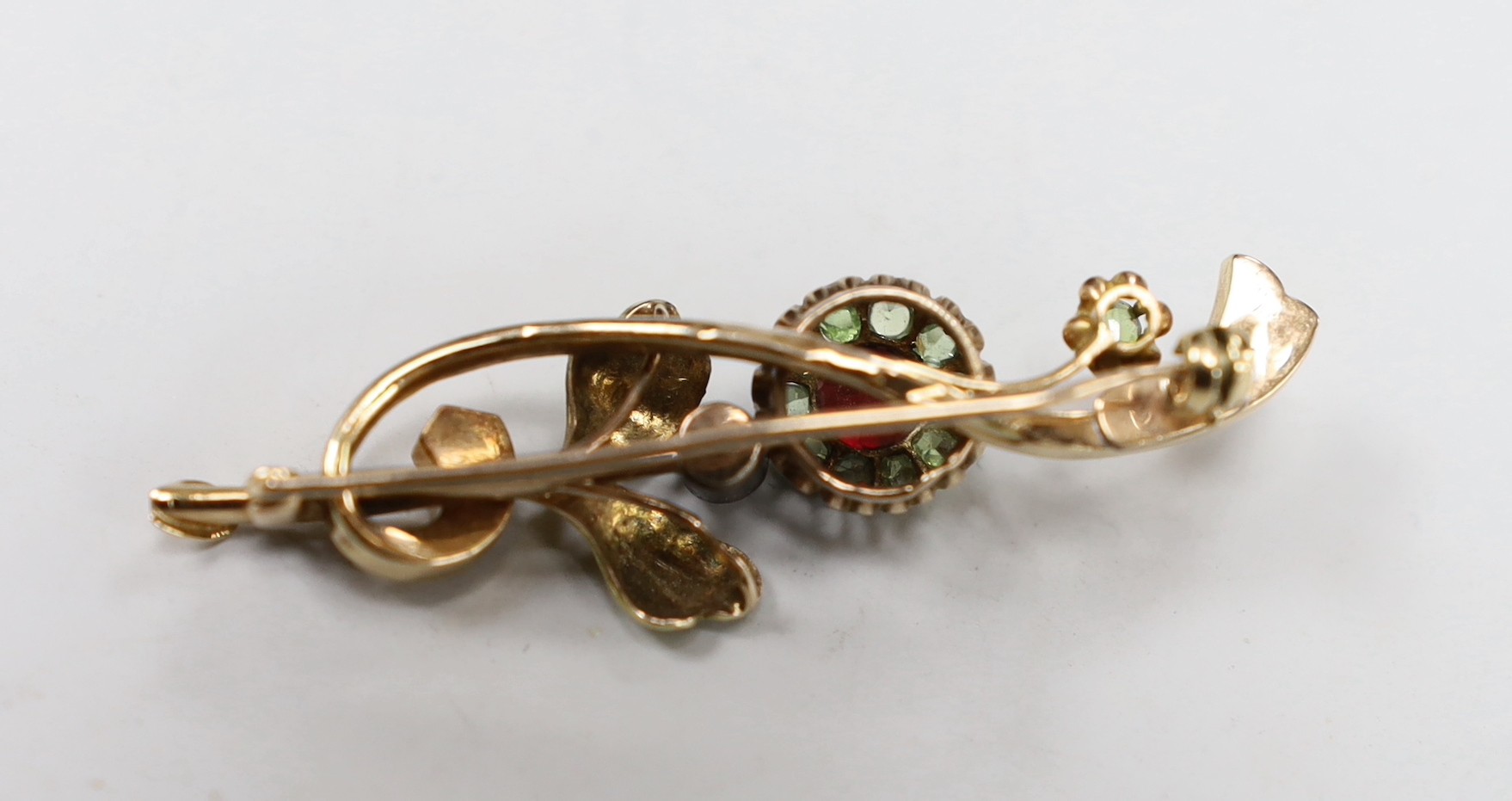 An early to mid 20th century Russian 56 zolotnik yellow metal, garnet? and split pearl set foliate brooch, 48mm, gross 4.3 grams.